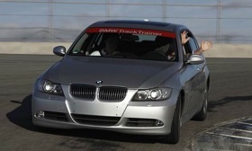 Our man Mark Vaughn drives a Bimmer with no hands on a racetrack.