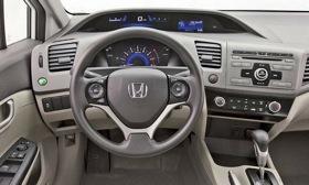 Critics have slammed Honda for using hard, inexpensive-looking plastic on the interior of the redesigned 2012 Civic. (Photo courtesy of AutoWeek.)