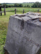 A gravestone marker on the spot where the arm of General Stonewall Jackson is buried is near the Ellwood house in Locust Grove, Va. Civil War history will play out in a rural Virginia courtroom this week when Wal-Mart Stores Inc. defends a planned store near the hallowed site where Robert E. Lee and Ulysses S. Grant first met on a battlefield in 1864 (© Steve Helber/AP)