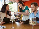 Image: Couple ordering meal in restaurant © NULL/Corbis
