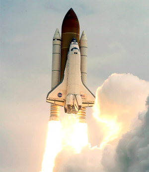 The space shuttle Atlantis blasts off for the final time (Image © John Raoux/AP)