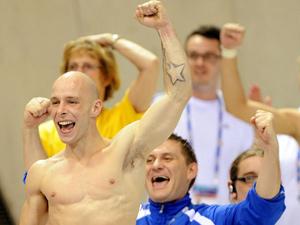 Pete Waterfield celebrates his bronze medal at the diving World Cup in London