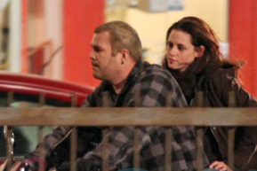Bella on a motorcycle with mystery man